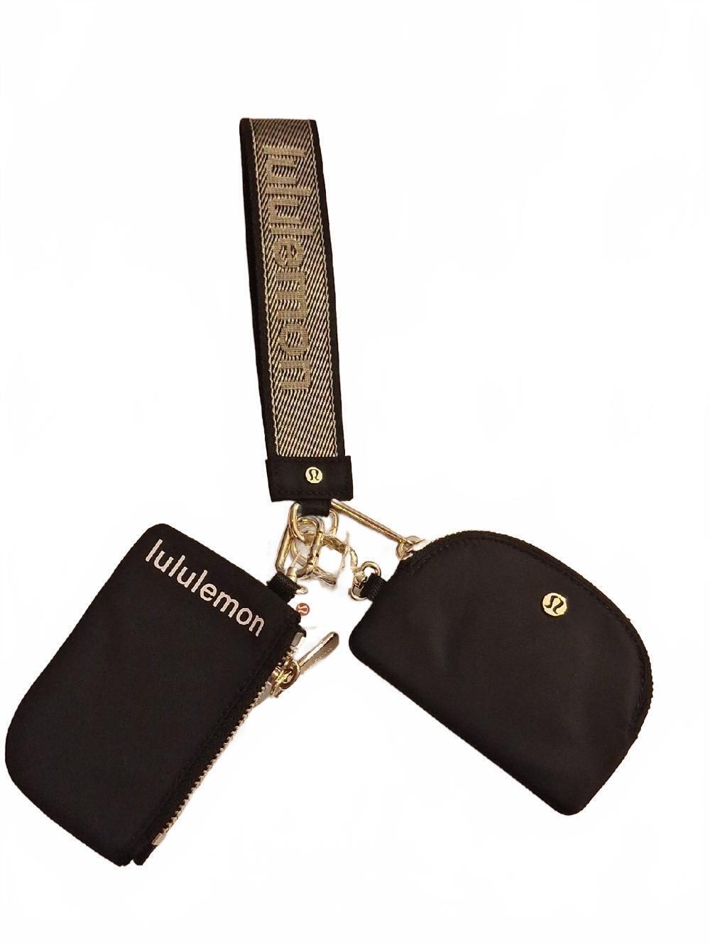 NWT Lululemon Dual Pouch Wristlet Wordmark Blk/gold